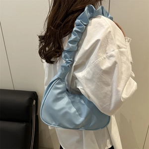 Sky blue pleated shoulder bag with wide ruffle strap and curved hobo design for women