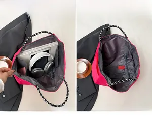 Detail view of large rose pink tote bag interior showing spacious compartments and storage