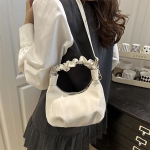 Chic off-white pleated crescent bag with marble texture and scrunchie handle