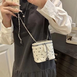 White quilted mini box bag with rhinestone accents and silver chain strap for women