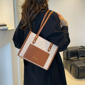 Large capacity tote bag with cream checkerboard pattern and brown leather straps