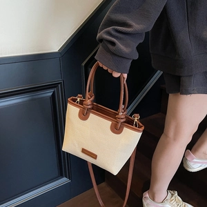 Retro cream canvas tote bag with brown leather trim and handles for summer fashion