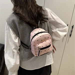 Pink mini backpack with black bow patterns and Fashion metal lettering for women