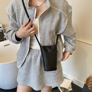 Minimalist black lychee texture crossbody phone bag for women with slim shoulder strap