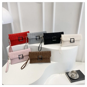 Detailed display of six leopard print envelope clutches with square buckle and wrist straps