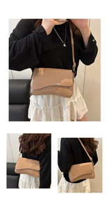 Detailed close-up of glossy patent leather texture and flap design on a beige crossbody bag