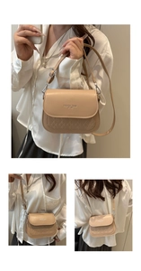 Detail of beige crossbody bag with quilted texture and Fashion Trend embossed logo