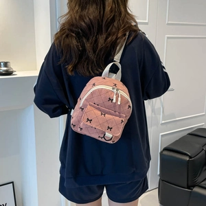 Rosa Mini-Rucksack aus Cord mit Schleifendruck und Steppmuster für Studentinnen