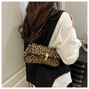 Detailed back view of a chic leopard print shoulder bag with gold metallic buckle