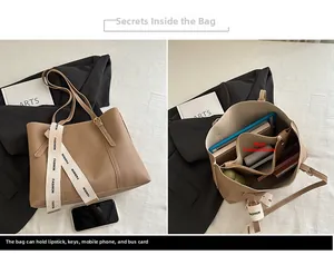 Detail view of khaki large tote bag interior showing multiple spacious compartments