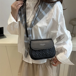 Fashionable black quilted shoulder bag with gold lettering and adjustable strap for women