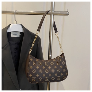 Detail view of the brown vintage monogram shoulder bag with gold chain and zipper