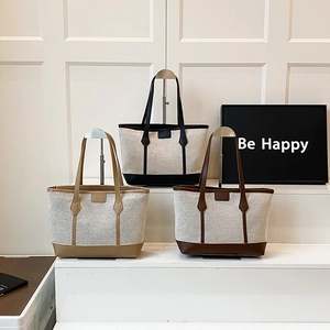 Minimalist canvas tote bags with leather trim in black, brown, and khaki for commuting