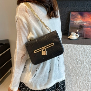 Chic black crocodile embossed shoulder bag with gold chain strap and square buckle