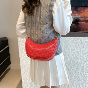 Stylish red woven crescent bag with metal chain strap for women, elegant commuter style