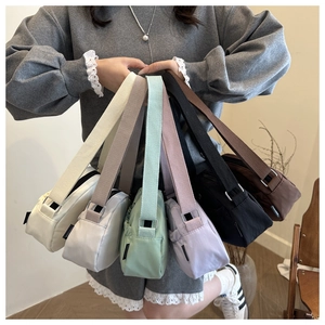 Collection of lightweight nylon backpacks in multiple colors with adjustable wide straps