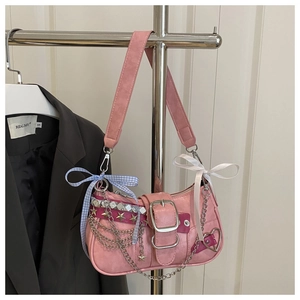 Pink Y2K shoulder bag featuring silver metal chains, star rivets and a blue plaid ribbon