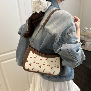 Fashionable cherry print shoulder bag with vintage white leather and brown trim