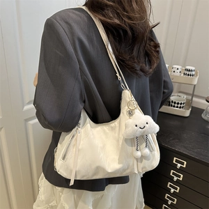 Minimalist beige hobo shoulder bag with adjustable strap and cute cloud charm detail