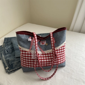 Sweet denim patchwork tote bag with red plaid bow and lace trim in a casual setting
