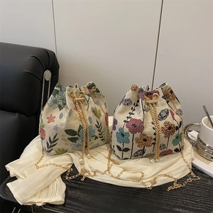 Floral jacquard nylon bucket bags with gold chain straps and elegant pearl accents