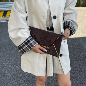 Brown snakeskin envelope clutch bag with gold metal trim and textured leather finish