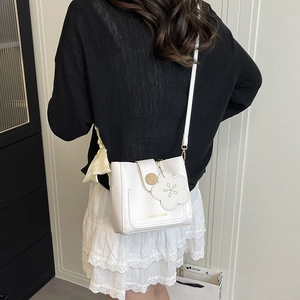 White PU leather bucket bag with flower charm and metal buckle for women