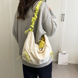 Minimalist creamy white oversized shoulder bag with neon yellow ruched strap for students