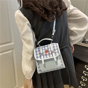 Light blue plaid crossbody bag with apple embroidery and adjustable shoulder strap