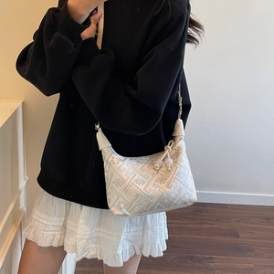 Ethnic style floral jacquard shoulder bag featuring retro patterns and knot strap detail