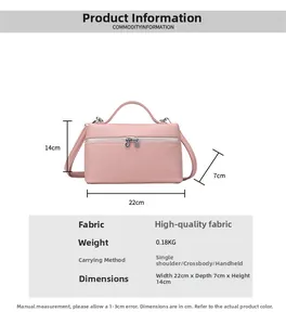 Pink minimalist crossbody bag featuring premium pebble leather texture and metal zipper detail