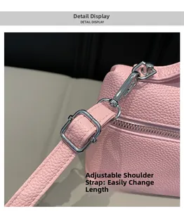Close-up of adjustable pink litchi grain leather strap with silver metal buckles