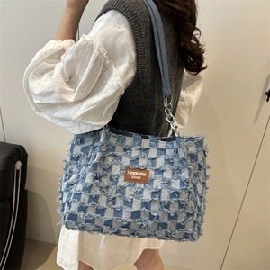 Blue denim checkered tote bag with frayed fringe and silver chain strap for women