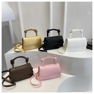 Detailed display of vintage leather crossbody bags in gold, black, white, brown and pink