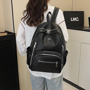 Waterproof black leather backpack with large capacity and stylish lychee texture
