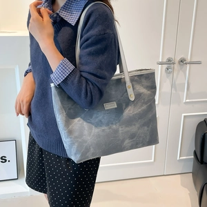 Minimalist grey-blue marble pattern tote bag with shoulder strap and metal logo for daily use