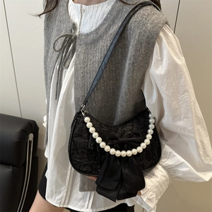 Chic black lace crescent bag with satin bow and pearl strap for stylish women