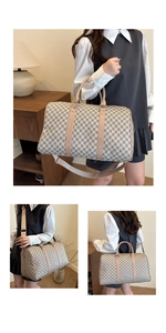 Detail view of large travel bag featuring vintage monogram print and adjustable strap