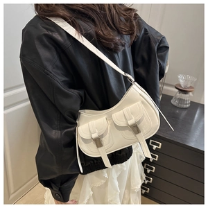 Detail of white PU leather crescent bag with double front pockets on a biker jacket