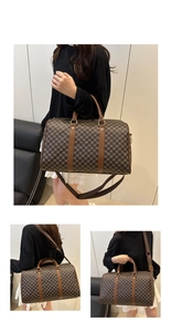 Detail view of large travel bag with brown repeating pattern and leather handles