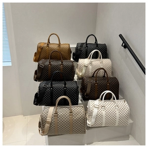 Multiple printed duffel bags arranged on stairs showing various colors and textures