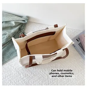 Top view of large canvas tote bag showing interior space and zipper pocket for storage
