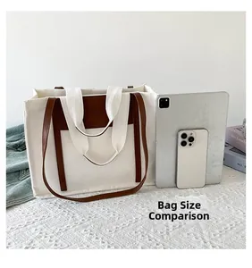 Size comparison of canvas tote bag with tablet and phone showing large storage capacity