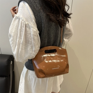 Brown patent leather tote bag with FASHION & BAGS print and detachable shoulder strap