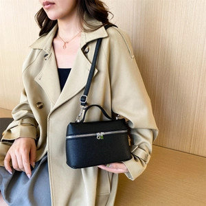 Minimalist black lychee leather crossbody box bag with silver hardware and top handle
