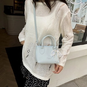 Light blue lychee pattern leather bucket bag with a pearl lace bow charm for women
