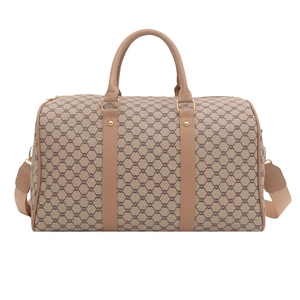 Large travel duffle bag with vintage monogram pattern and brown leather straps