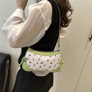 Trendy white canvas shoulder bag with cherry print and green leather trim details