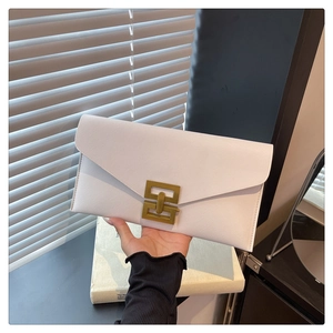 Detail of white cross-grain leather envelope bag with gold geometric metal buckle and flap