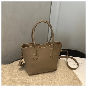 Macro view of beige synthetic leather bucket bag texture with Fashion debossed detail